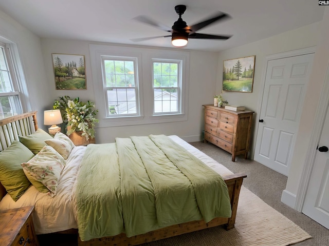 bedroom featuring carpet, ceiling fan, and baseboards