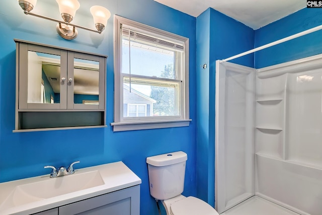 full bath with a shower, toilet, and vanity