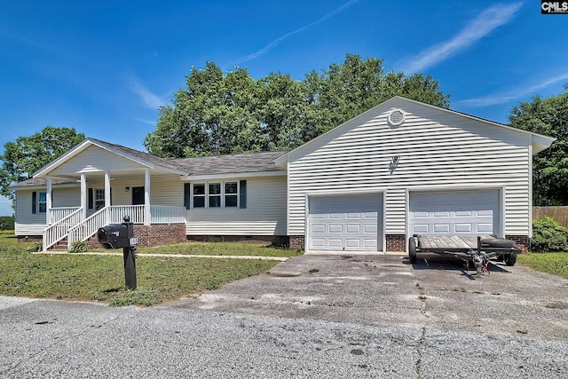 ranch-style house with a porch, crawl space, a garage, and asphalt driveway
