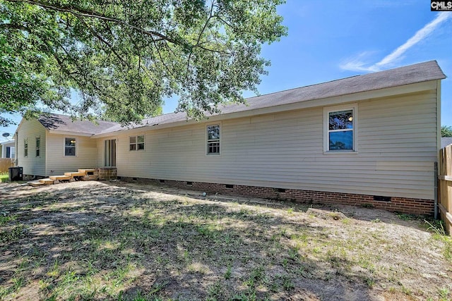 back of property featuring crawl space and cooling unit