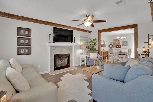 117 Rosewood Ln, Lexington, SC 29072 - living room featuring ceiling fan, wood finished floors, a tile fireplace, a chandelier, and baseboards