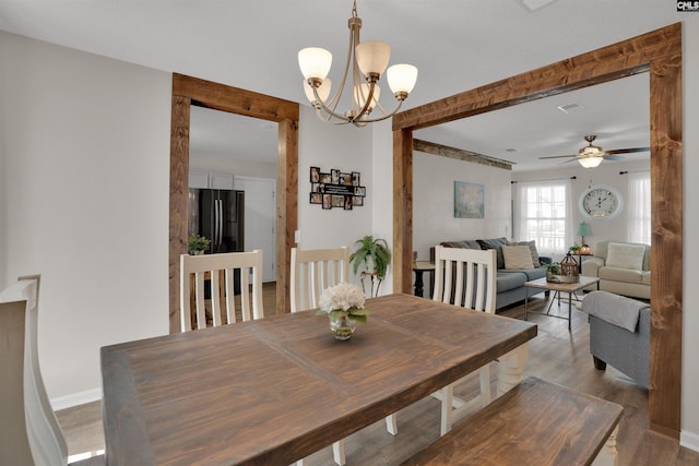 117 Rosewood Ln, Lexington, SC 29072 - dining area with a chandelier, wood finished floors, baseboards, and a ceiling fan