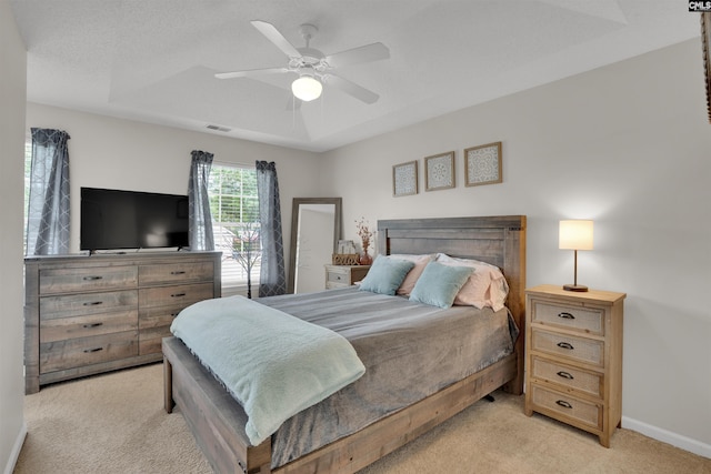 117 Rosewood Ln, Lexington, SC 29072 - bedroom with light colored carpet, baseboards, ceiling fan, and a raised ceiling