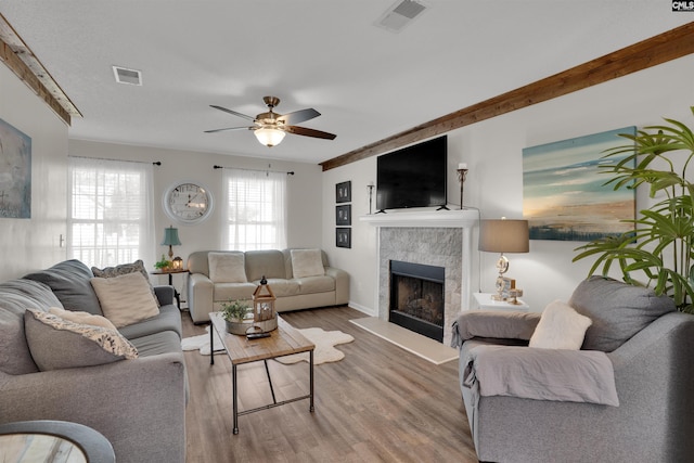 117 Rosewood Ln, Lexington, SC 29072 - living room with a tiled fireplace, a ceiling fan, and wood finished floors