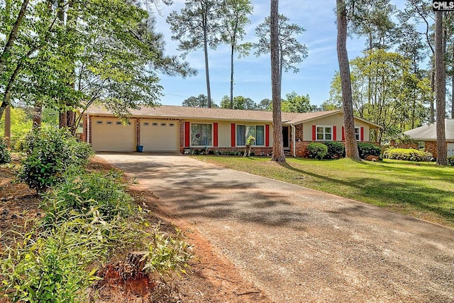 single story home featuring concrete driveway, an attached garage, brick siding, and a front lawn