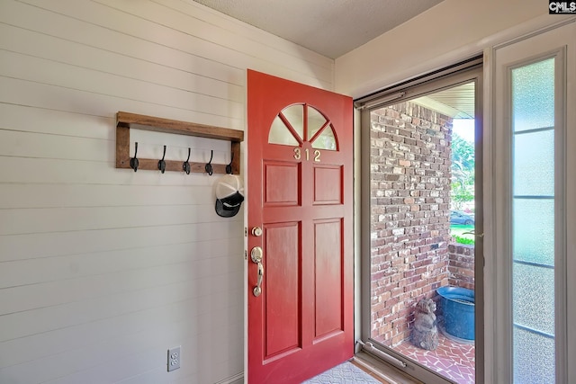 entrance foyer with wood walls