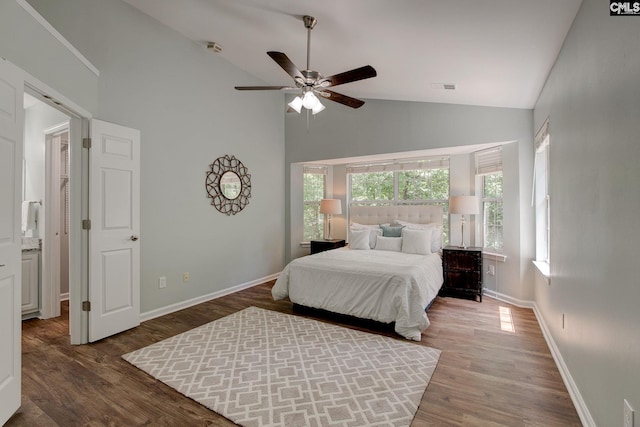bedroom with high vaulted ceiling, wood finished floors, baseboards, and a ceiling fan