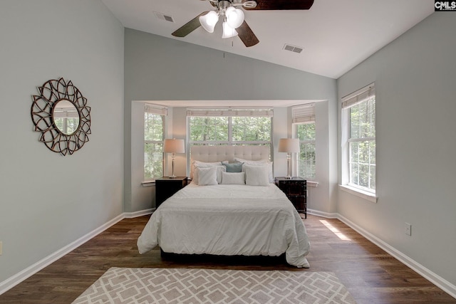 bedroom featuring vaulted ceiling, wood finished floors, baseboards, and a ceiling fan