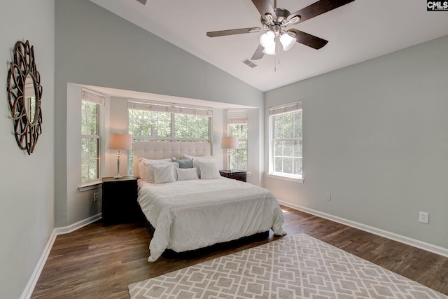bedroom featuring lofted ceiling, baseboards, wood finished floors, and ceiling fan