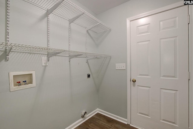 washroom with washer hookup, hookup for an electric dryer, baseboards, and dark wood finished floors