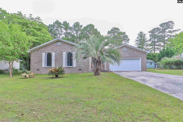 ranch-style house with brick siding, driveway, a garage, and a front yard