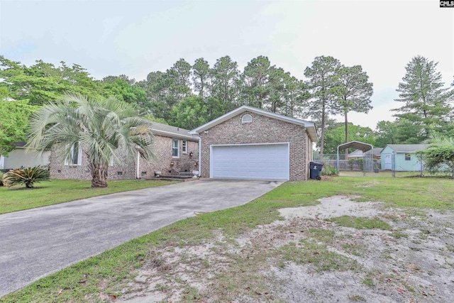 ranch-style home with brick siding, concrete driveway, an attached garage, and a carport
