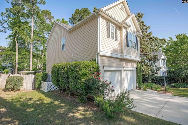 103 Beacon Ln, Columbia, SC 29229 - view of property exterior featuring a garage, fence, and driveway