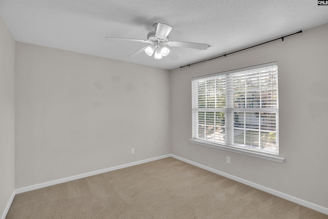 103 Beacon Ln, Columbia, SC 29229 - empty room with light carpet, a ceiling fan, baseboards, and a textured ceiling