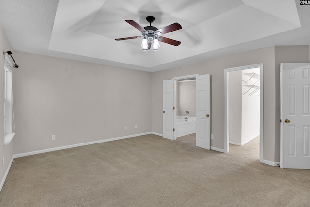 103 Beacon Ln, Columbia, SC 29229 - unfurnished bedroom featuring light colored carpet, a raised ceiling, baseboards, and ensuite bathroom