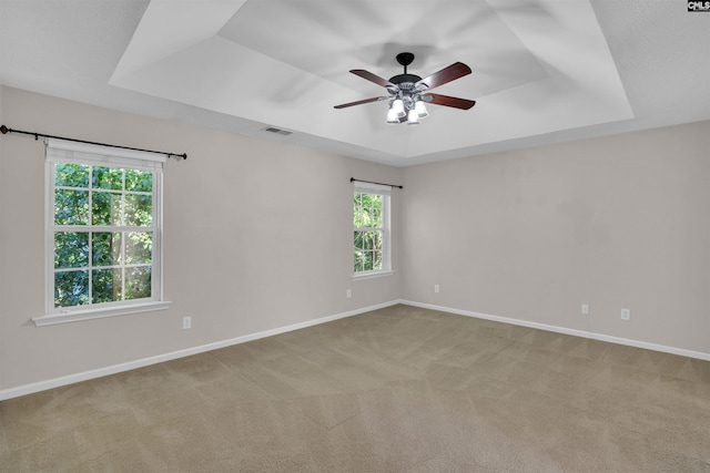 103 Beacon Ln, Columbia, SC 29229 - unfurnished room with a raised ceiling, a ceiling fan, carpet, and baseboards