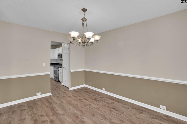 103 Beacon Ln, Columbia, SC 29229 - unfurnished room with a chandelier, wood finished floors, and baseboards