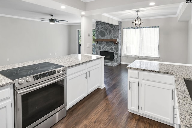 284 Outrigger Ln, Columbia, SC 29212 - kitchen with electric stove, crown molding, dark wood finished floors, white cabinetry, and a fireplace