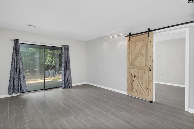 284 Outrigger Ln, Columbia, SC 29212 - spare room with a barn door and baseboards