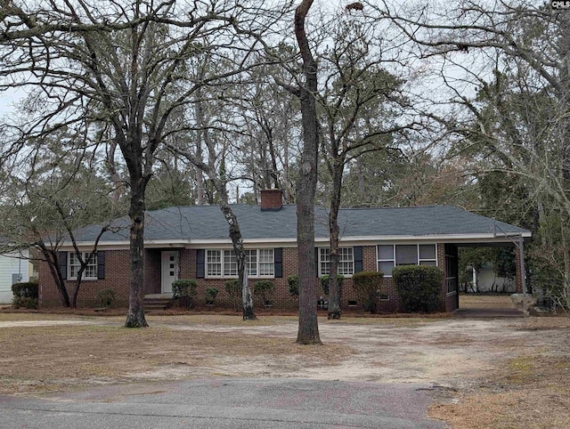 6427 Briarwood Rd, Columbia, SC 29206 - single story home featuring a chimney, brick siding, driveway, and an attached carport