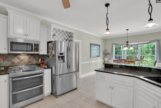17 Laurel Bluff Ct, Columbia, SC 29229 - kitchen with appliances with stainless steel finishes, white cabinetry, light tile patterned flooring, pendant lighting, and backsplash