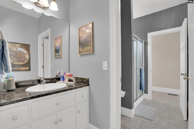 17 Laurel Bluff Ct, Columbia, SC 29229 - bathroom with a stall shower, tile patterned floors, vanity, and baseboards
