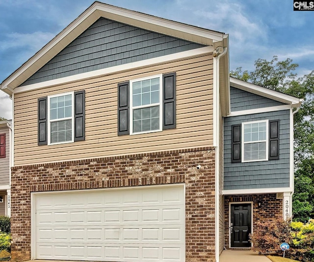 2040 Elmridge Rd, Columbia, SC 29209 - view of front of home with brick siding, an attached garage, and concrete driveway