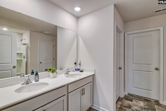 2040 Elmridge Rd, Columbia, SC 29209 - bathroom with double vanity, baseboards, stone finish flooring, and a shower