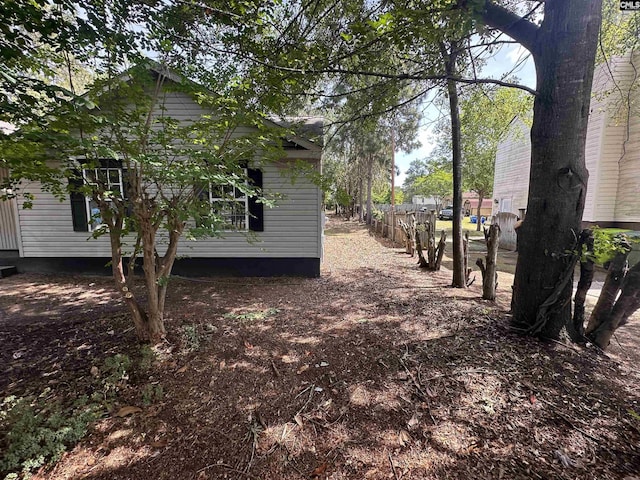 view of side of property with fence