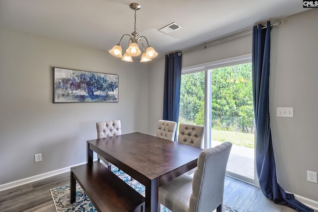 171 Turnfield Dr, West Columbia, SC 29170 - dining area featuring a chandelier, wood finished floors, and baseboards
