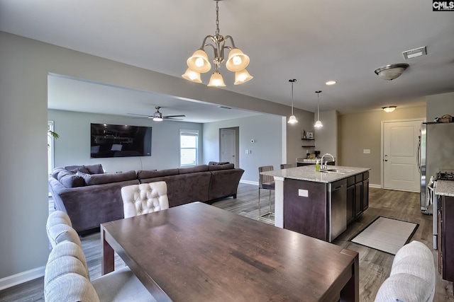 171 Turnfield Dr, West Columbia, SC 29170 - dining room featuring a chandelier, dark wood-style floors, baseboards, and a ceiling fan