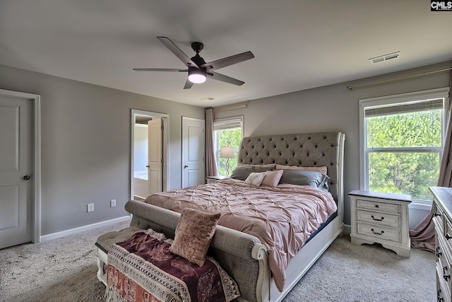171 Turnfield Dr, West Columbia, SC 29170 - bedroom featuring light carpet, baseboards, ensuite bath, and a ceiling fan