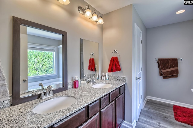 171 Turnfield Dr, West Columbia, SC 29170 - full bathroom with wood finished floors, double vanity, and baseboards