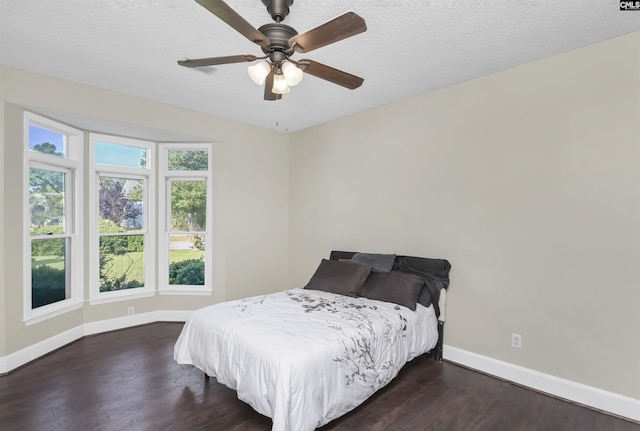 112 Gateway Ln, Columbia, SC 29210 - bedroom featuring baseboards, dark wood-style floors, a ceiling fan, and a textured ceiling