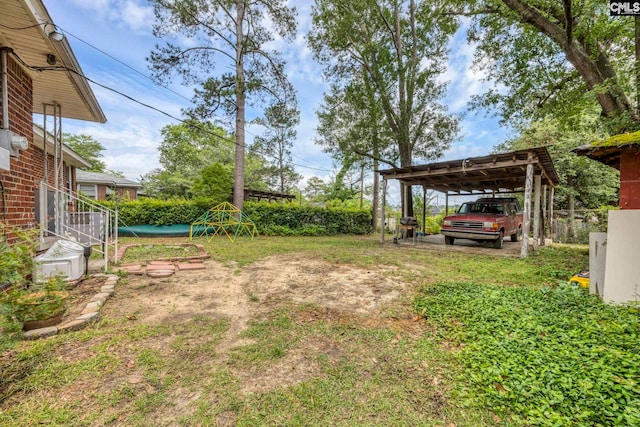 1217 Jensen St, West Columbia, SC 29169 - view of yard featuring a carport and fence