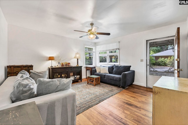 1217 Jensen St, West Columbia, SC 29169 - living area featuring healthy amount of natural light, light wood-style flooring, a ceiling fan, and baseboards
