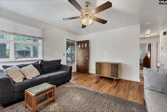 1217 Jensen St, West Columbia, SC 29169 - living area featuring wood finished floors, a ceiling fan, and baseboards
