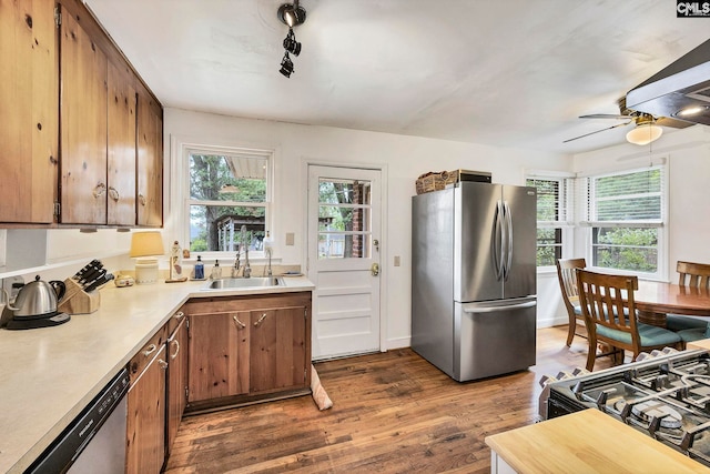 1217 Jensen St, West Columbia, SC 29169 - kitchen featuring appliances with stainless steel finishes, a sink, dark wood finished floors, light countertops, and ceiling fan