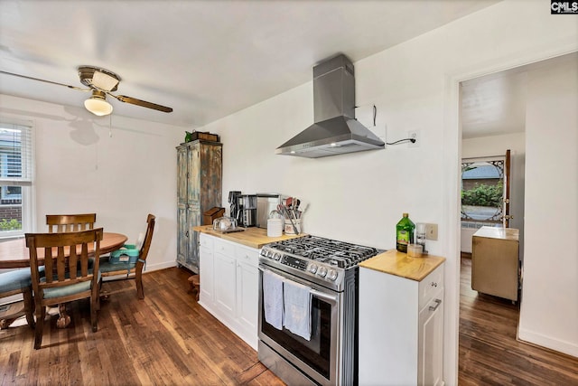 1217 Jensen St, West Columbia, SC 29169 - kitchen with gas range, wall chimney range hood, wooden counters, and dark wood finished floors