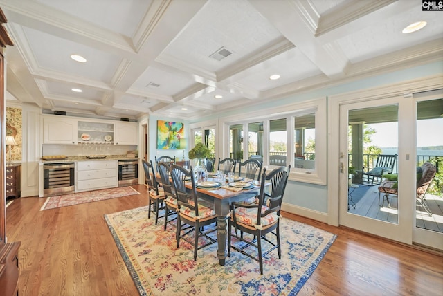 dining room featuring wine cooler, coffered ceiling, light wood finished floors, beam ceiling, and recessed lighting