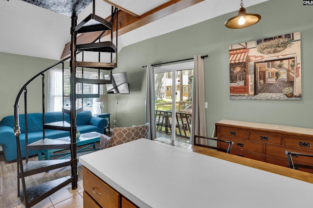 stairway with tile patterned floors