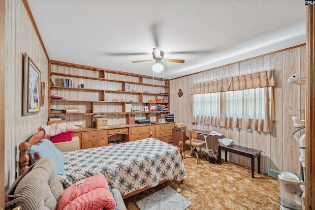 carpeted bedroom with wood walls, a textured ceiling, and ornamental molding