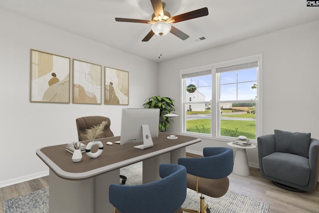 office featuring wood finished floors, ceiling fan, and baseboards
