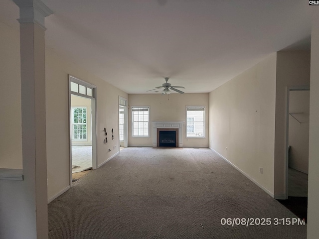 153 Berkeley Ridge Dr, Columbia, SC 29229 - unfurnished living room with carpet flooring, a ceiling fan, and a fireplace