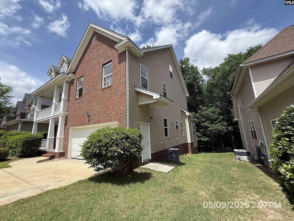 153 Berkeley Ridge Dr, Columbia, SC 29229 - view of side of property with a garage, brick siding, a yard, concrete driveway, and central AC unit