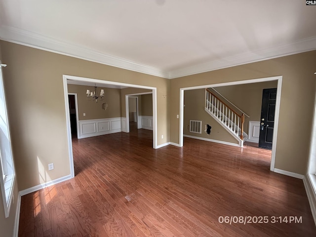 153 Berkeley Ridge Dr, Columbia, SC 29229 - spare room with a chandelier, ornamental molding, stairway, and wood finished floors