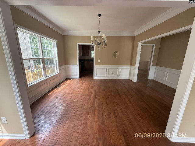 153 Berkeley Ridge Dr, Columbia, SC 29229 - unfurnished dining area with a chandelier, wood finished floors, a decorative wall, a wainscoted wall, and ornamental molding