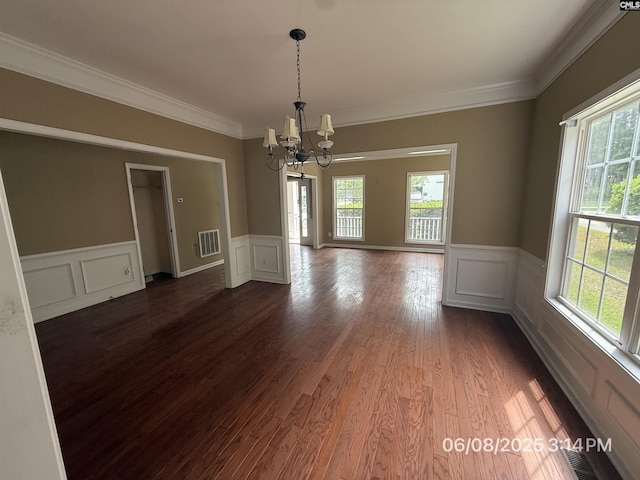 153 Berkeley Ridge Dr, Columbia, SC 29229 - unfurnished room with a chandelier, healthy amount of natural light, a wainscoted wall, a decorative wall, and ornamental molding