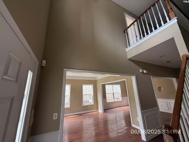 153 Berkeley Ridge Dr, Columbia, SC 29229 - entrance foyer with a towering ceiling, wood finished floors, stairway, wainscoting, and a decorative wall