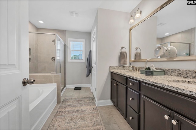 full bathroom featuring a shower stall, a garden tub, double vanity, tile patterned floors, and baseboards